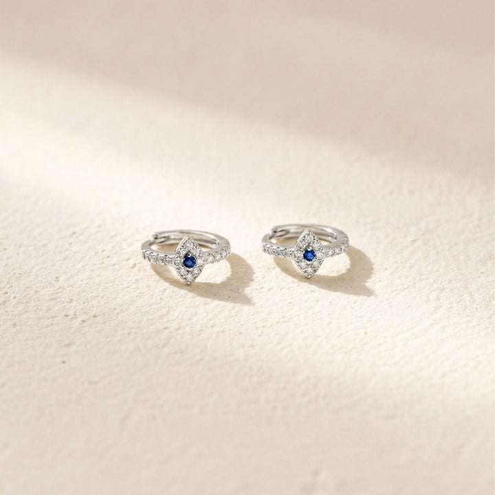 August Silver Evil Eye Huggie Earrings