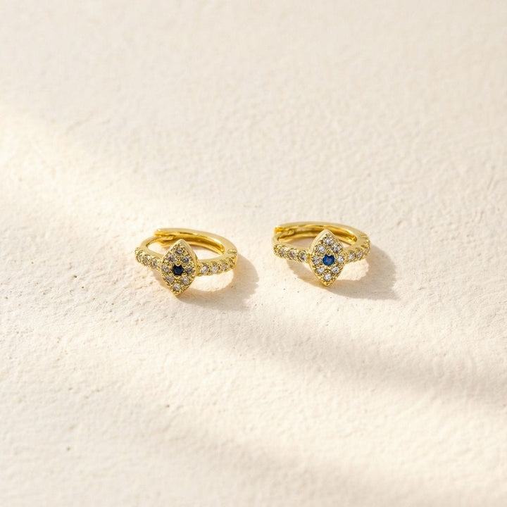August Evil Eye Gold Huggie Earrings