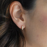 Pave Bezel Huggie Hoop Earrings Gold on model