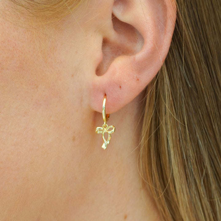 Élise Bow Gold Drop Earrings on Model