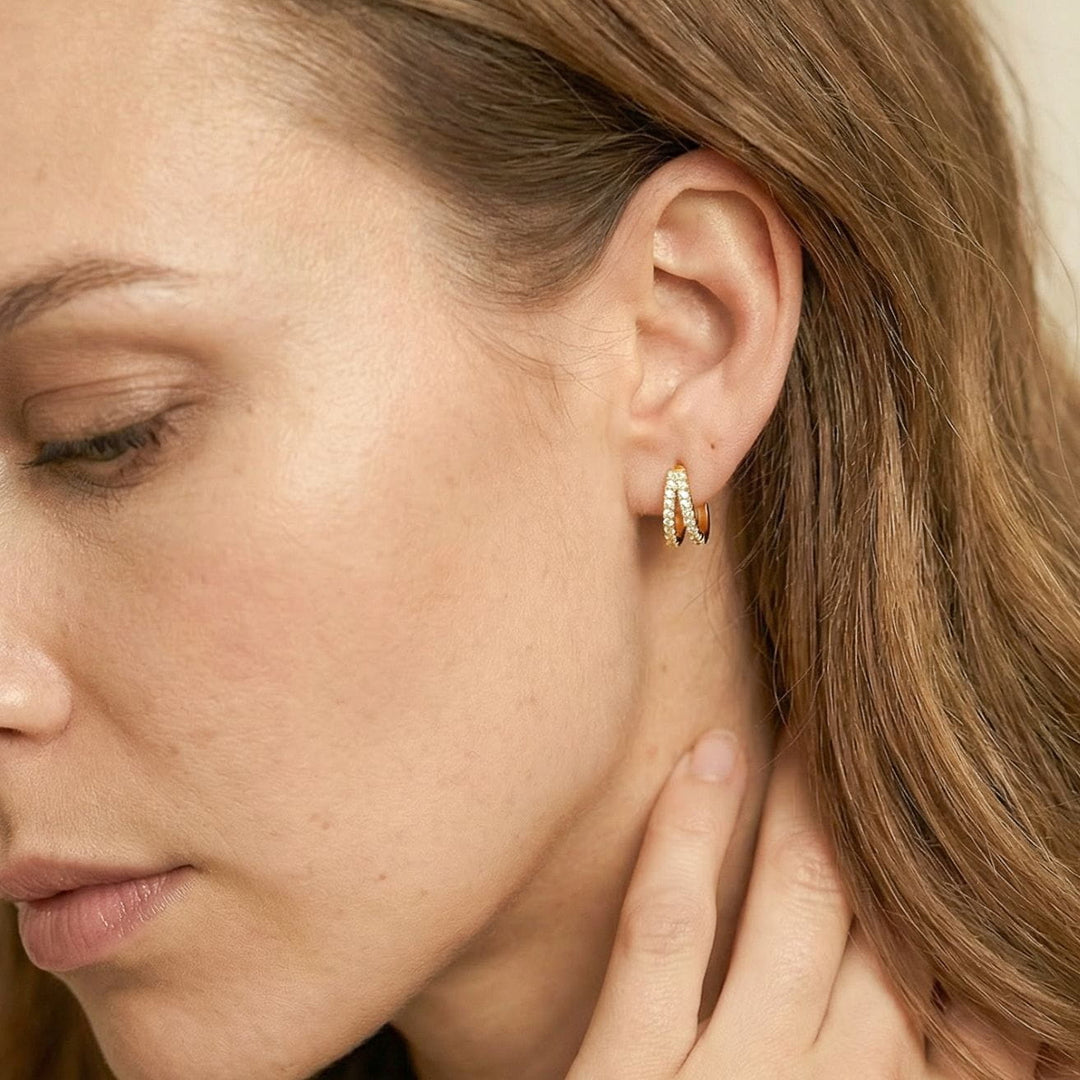 Kaylee Gold Double Pave Huggie Earrings on model side profile