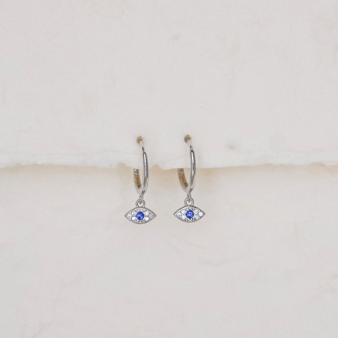 أقراط Elanor Evil Eye Drop Huggie فضية