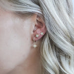 Tara Star Stud Earrings in an ear stack