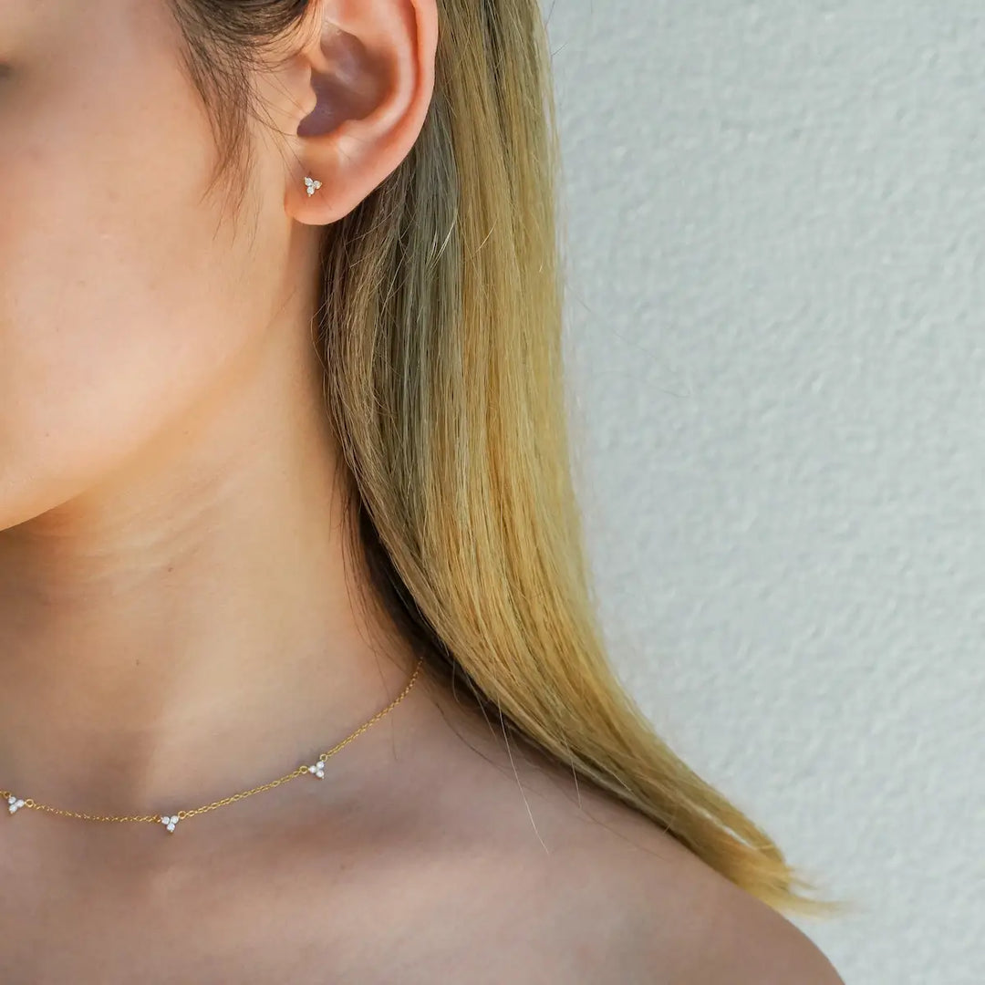 Liliah Trio Stud Earrings Gold with matching necklace