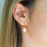 Freshwater Pearl Drop Huggie Earrings Gold on model