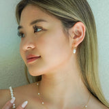 Freshwater Pearl Drop Huggie Earrings Gold on model